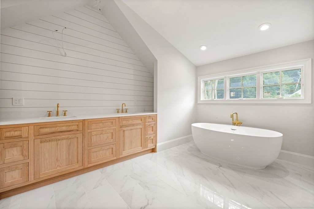 22 Suffolk Road Wellesley, MA 02481 - Photo 25 of 39 a spacious bathroom with sink mirror and bathtub