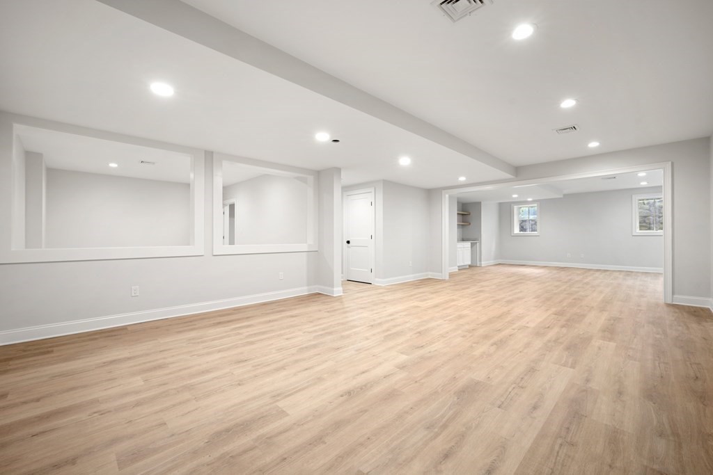 22 Suffolk Road Wellesley, MA 02481 - Photo 28 of 39 a view of empty room with wooden floor