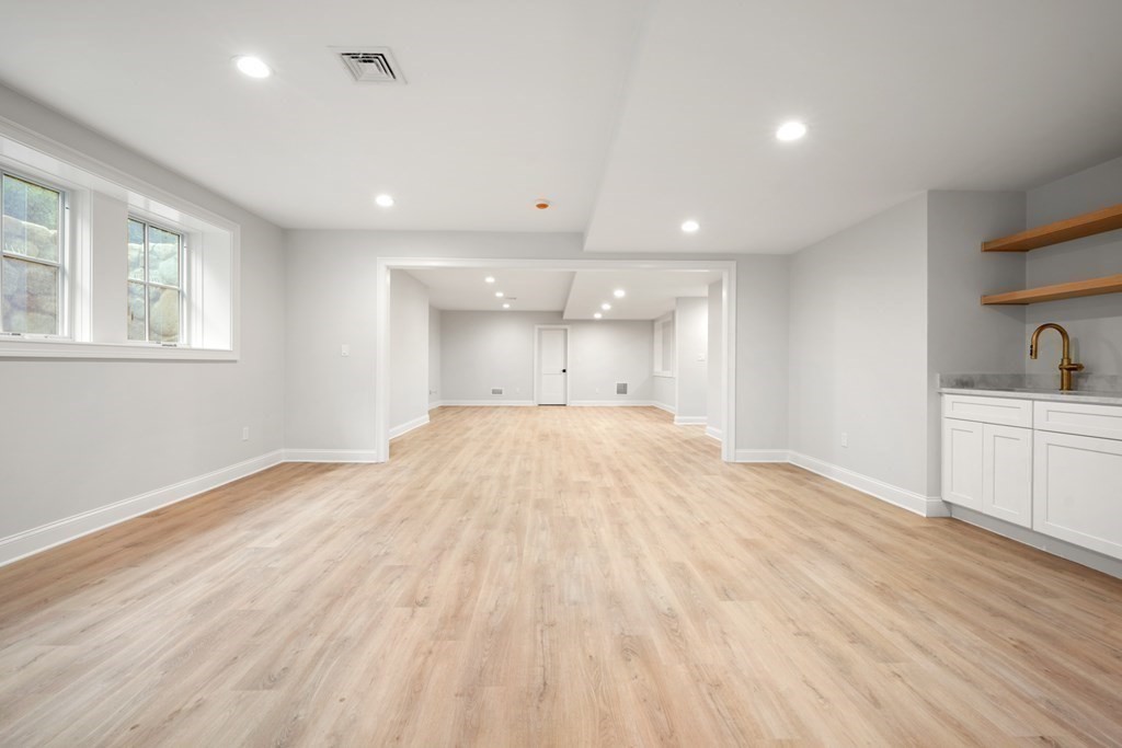 22 Suffolk Road Wellesley, MA 02481 - Photo 30 of 39 a view of empty room with wooden floor and window