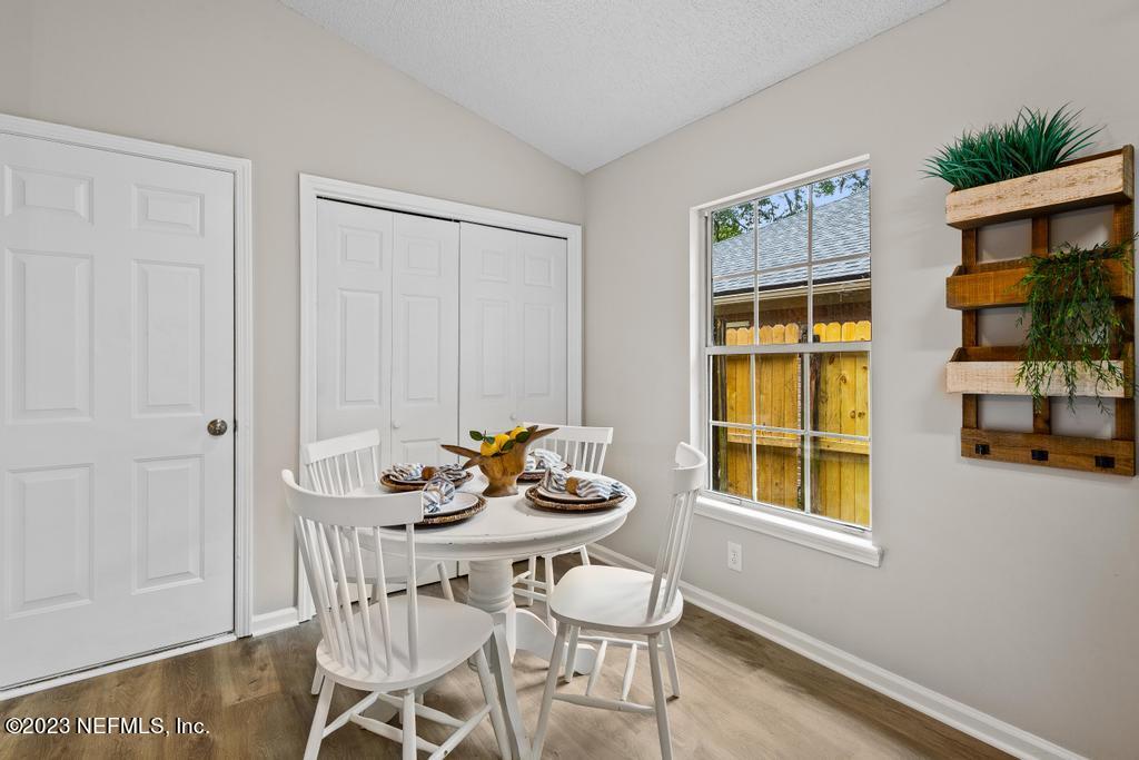 1652 Spring Oaks Lane Jacksonville, FL 32221 - Photo 12 of 37 a dining room with furniture and window