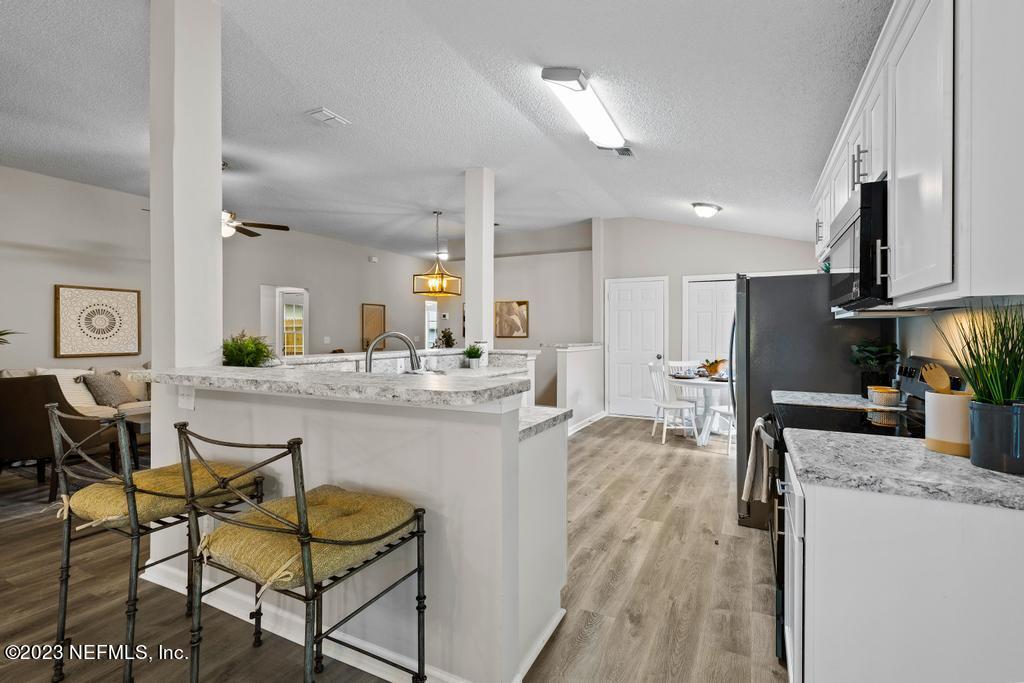 1652 Spring Oaks Lane Jacksonville, FL 32221 - Photo 20 of 37 a view of a kitchen and dining table