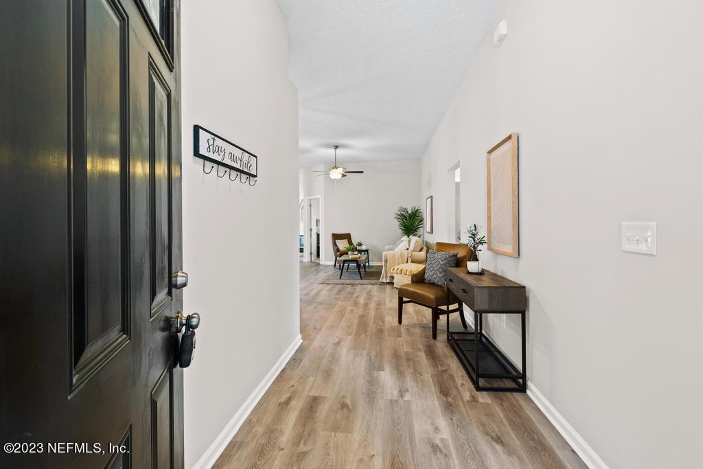 1652 Spring Oaks Lane Jacksonville, FL 32221 - Photo 2 of 37 a living room with furniture and a wooden floor