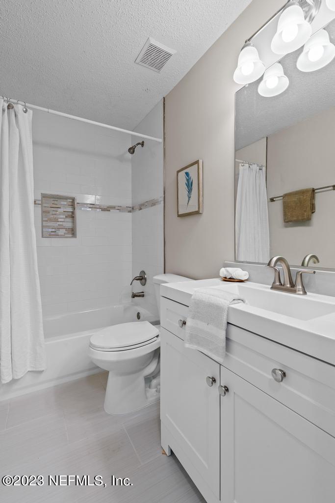 1652 Spring Oaks Lane Jacksonville, FL 32221 - Photo 25 of 37 a bathroom with a sink a toilet and shower