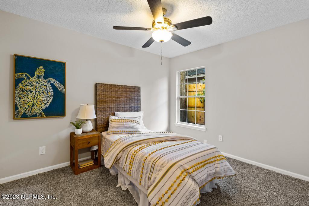1652 Spring Oaks Lane Jacksonville, FL 32221 - Photo 26 of 37 a bedroom with a bed and a window