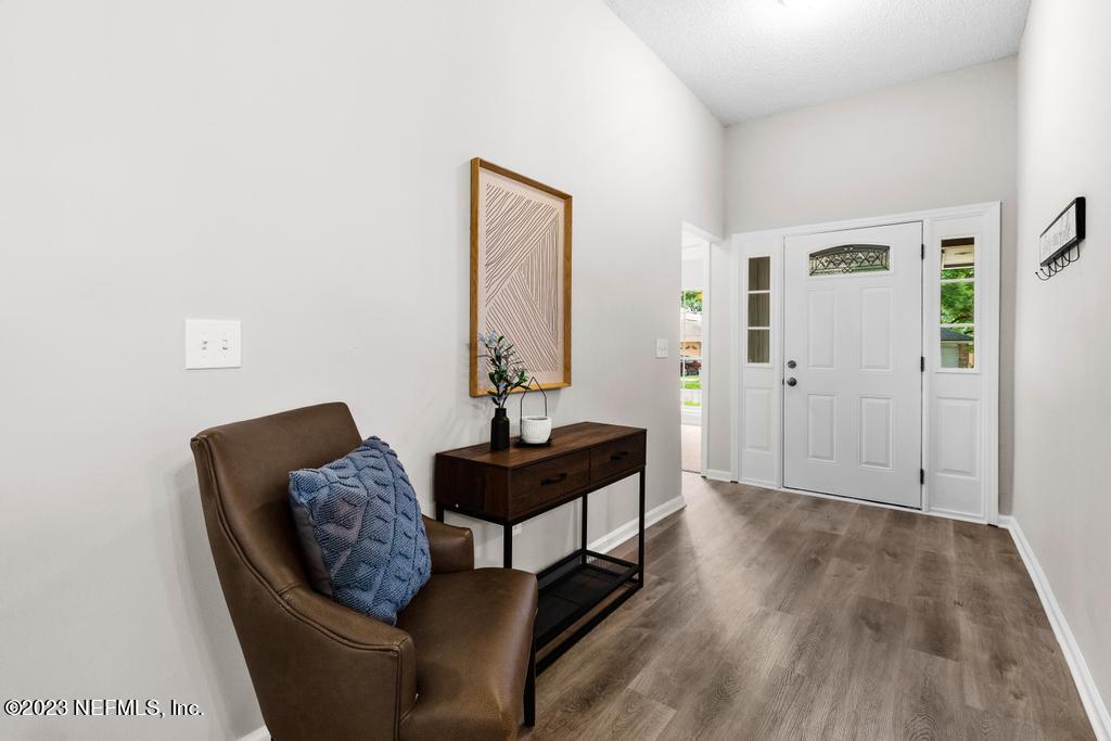 1652 Spring Oaks Lane Jacksonville, FL 32221 - Photo 3 of 37 a living room with furniture and wooden floor