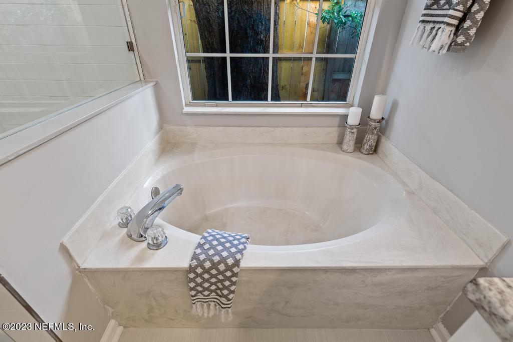 1652 Spring Oaks Lane Jacksonville, FL 32221 - Photo 31 of 37 a bath tub sitting next to a window