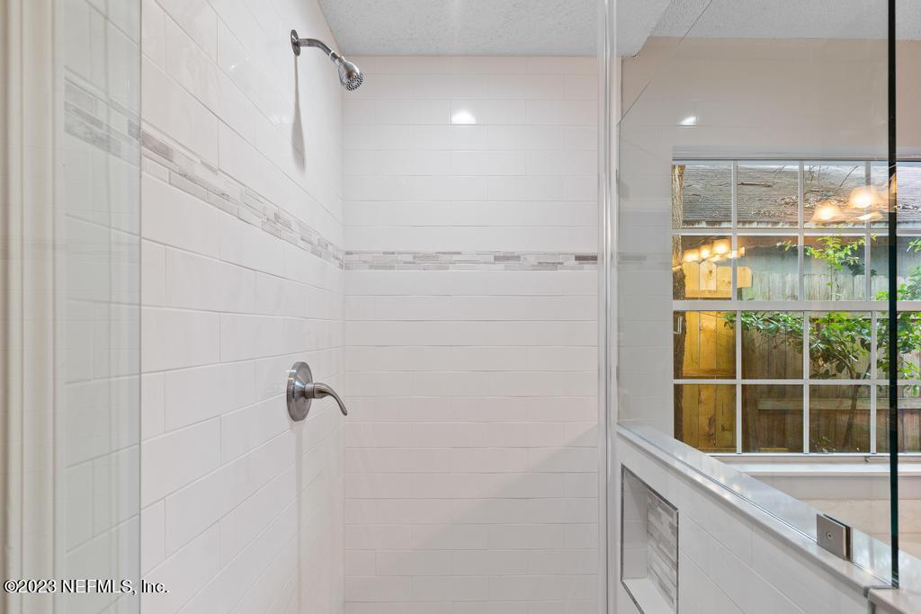 1652 Spring Oaks Lane Jacksonville, FL 32221 - Photo 32 of 37 a bathroom with a shower and a sink