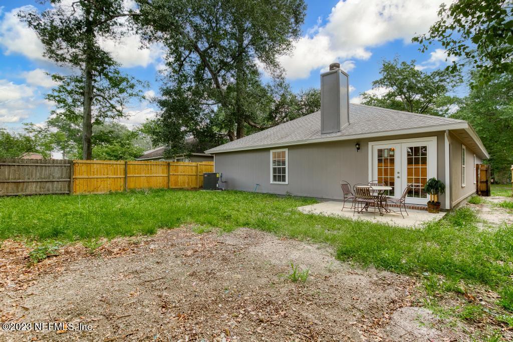 1652 Spring Oaks Lane Jacksonville, FL 32221 - Photo 37 of 37 a view of backyard with swimming pool and porch