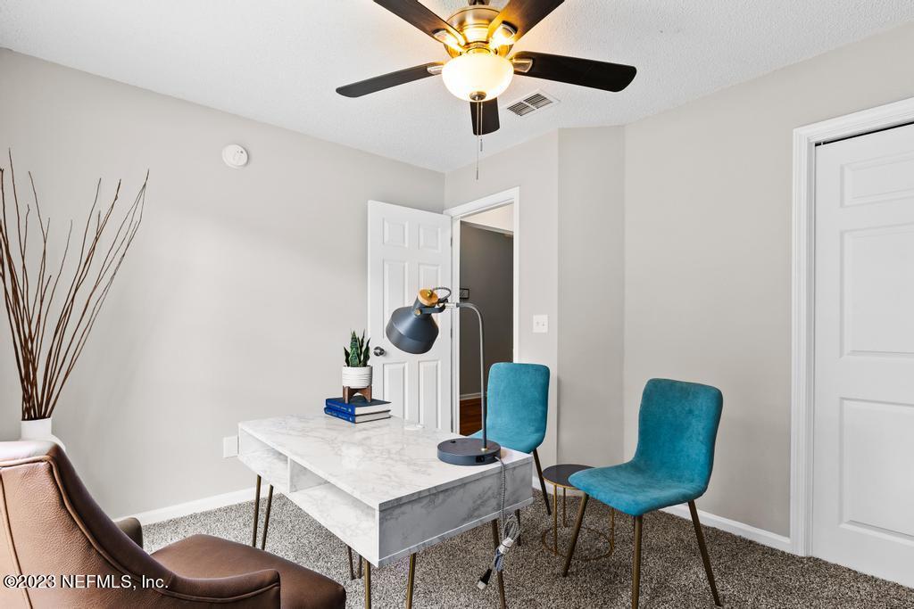 1652 Spring Oaks Lane Jacksonville, FL 32221 - Photo 5 of 37 a living room with furniture and a table