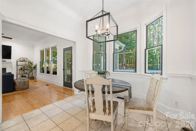 a kitchen with granite countertop a refrigerator stove and microwave