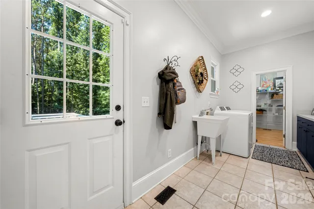 a kitchen with granite countertop white cabinets stainless steel appliances and sink