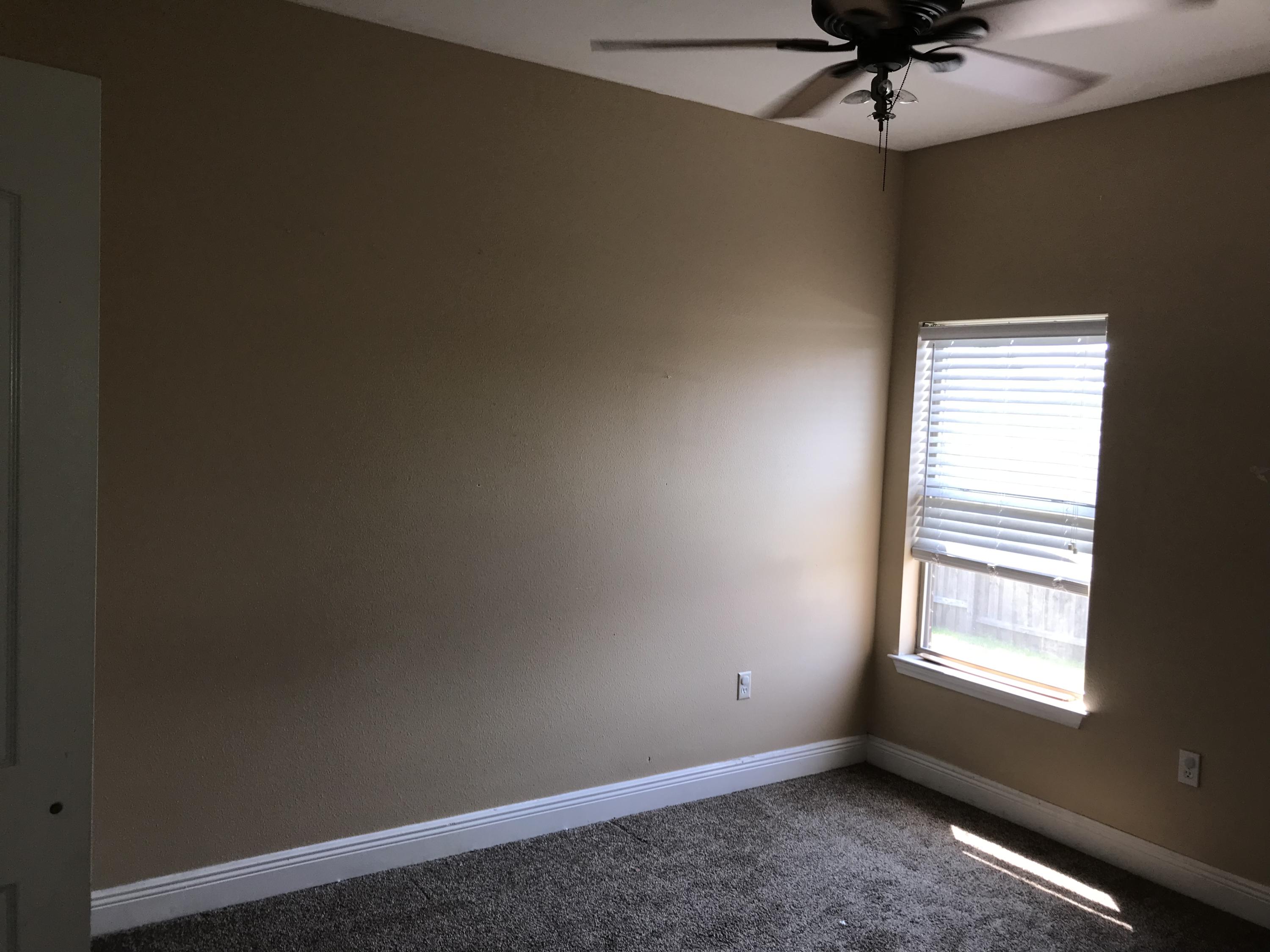 402 Wych Circle Crestview, FL 32536 - Photo 12 of 17 an empty room with a window and a fan