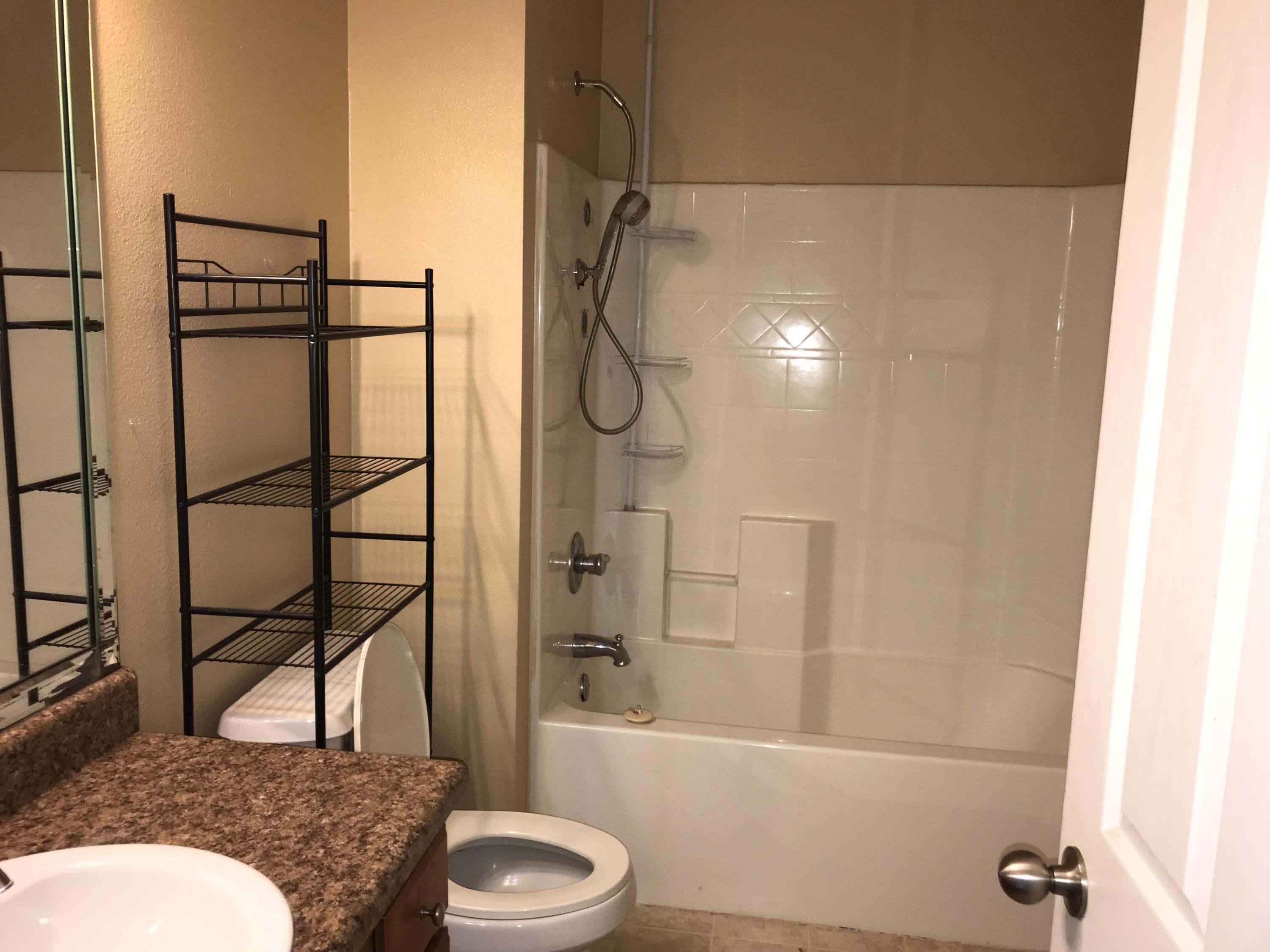 402 Wych Circle Crestview, FL 32536 - Photo 13 of 17 a bathroom with a toilet and shower