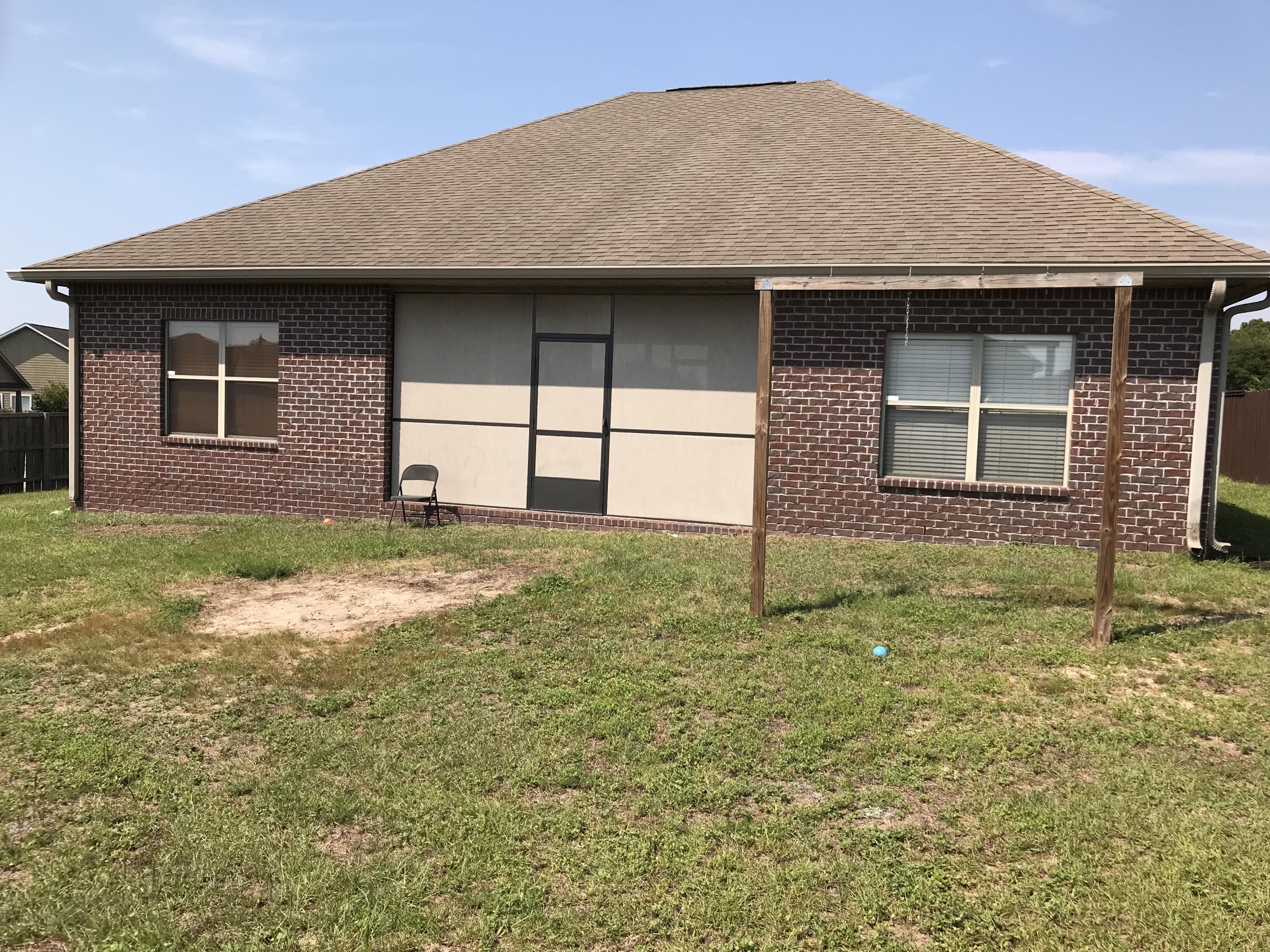 402 Wych Circle Crestview, FL 32536 - Photo 15 of 17 a house with yard in front of it