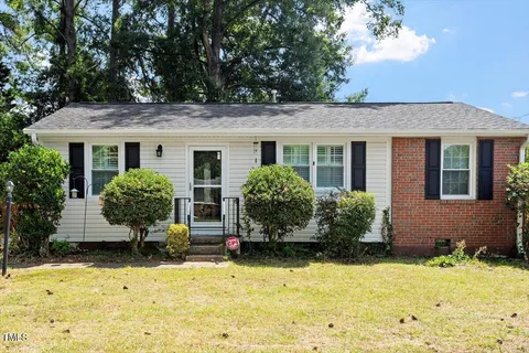 a front view of a house with yard