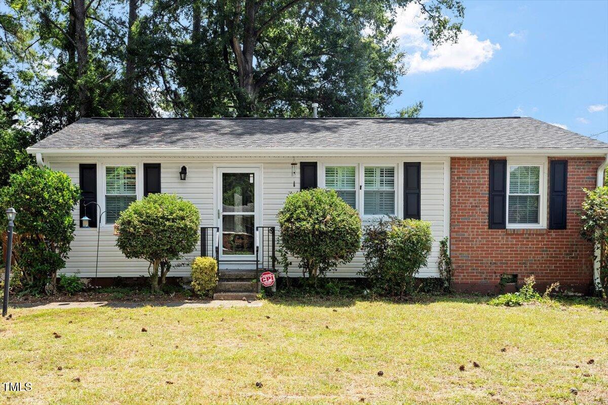 a front view of a house with yard