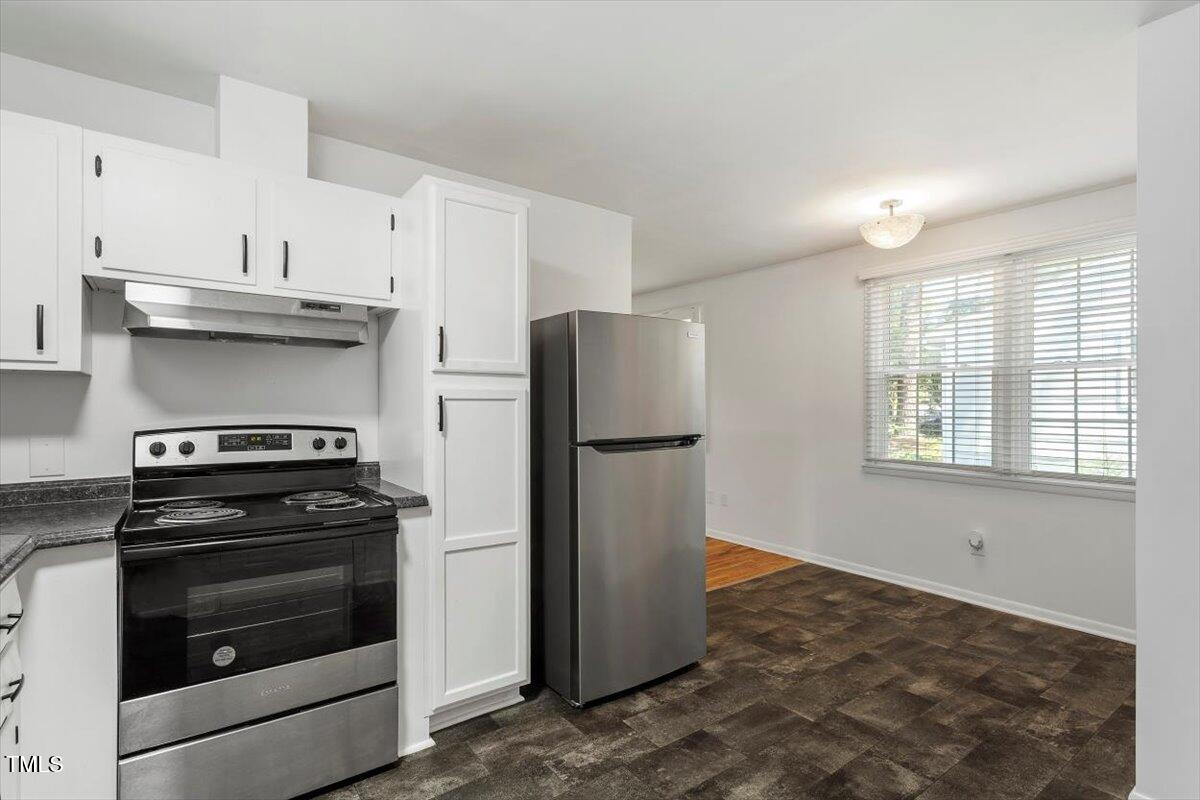 1621 Seminole Trail Raleigh, NC 27609 - Photo 12 of 25 a kitchen with a stove and a refrigerator