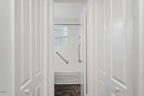 a bathroom with a glass shower door