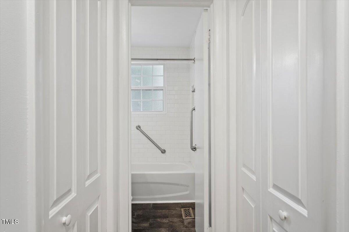 1621 Seminole Trail Raleigh, NC 27609 - Photo 14 of 25 a bathroom with a glass shower door
