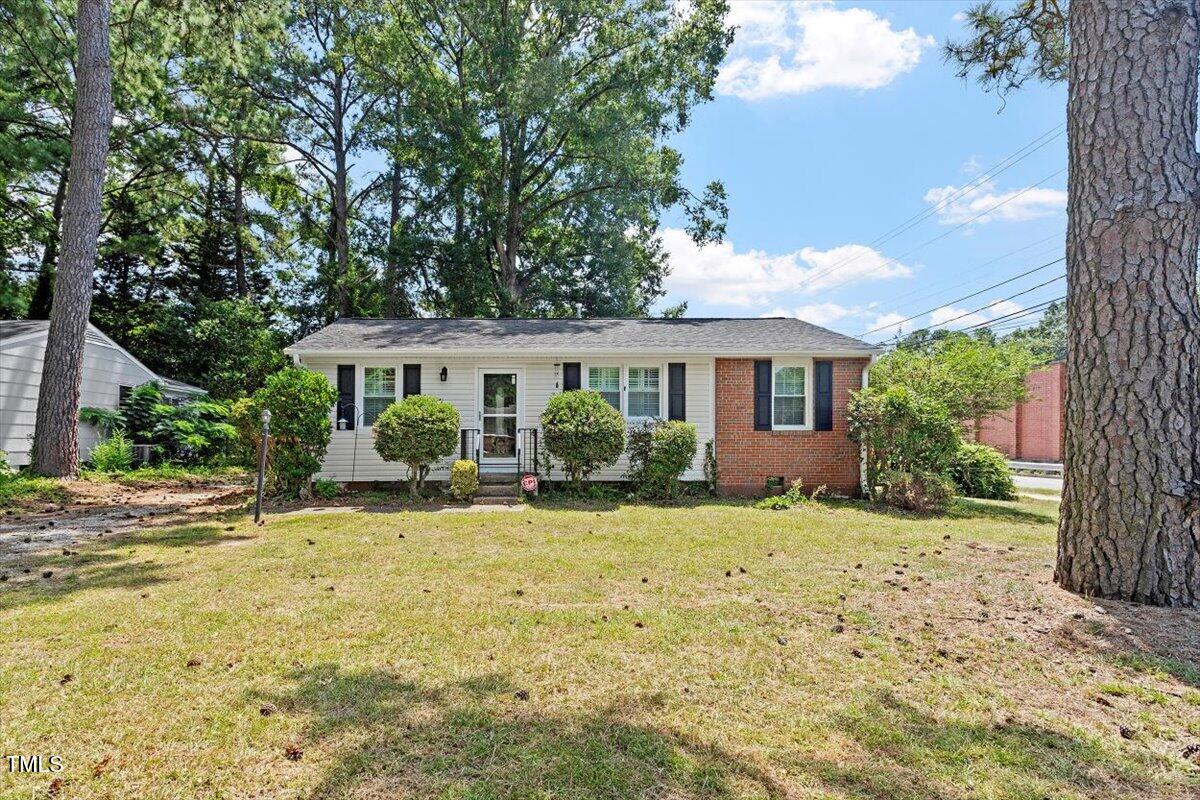 1621 Seminole Trail Raleigh, NC 27609 - Photo 2 of 25 a front view of a house with a yard