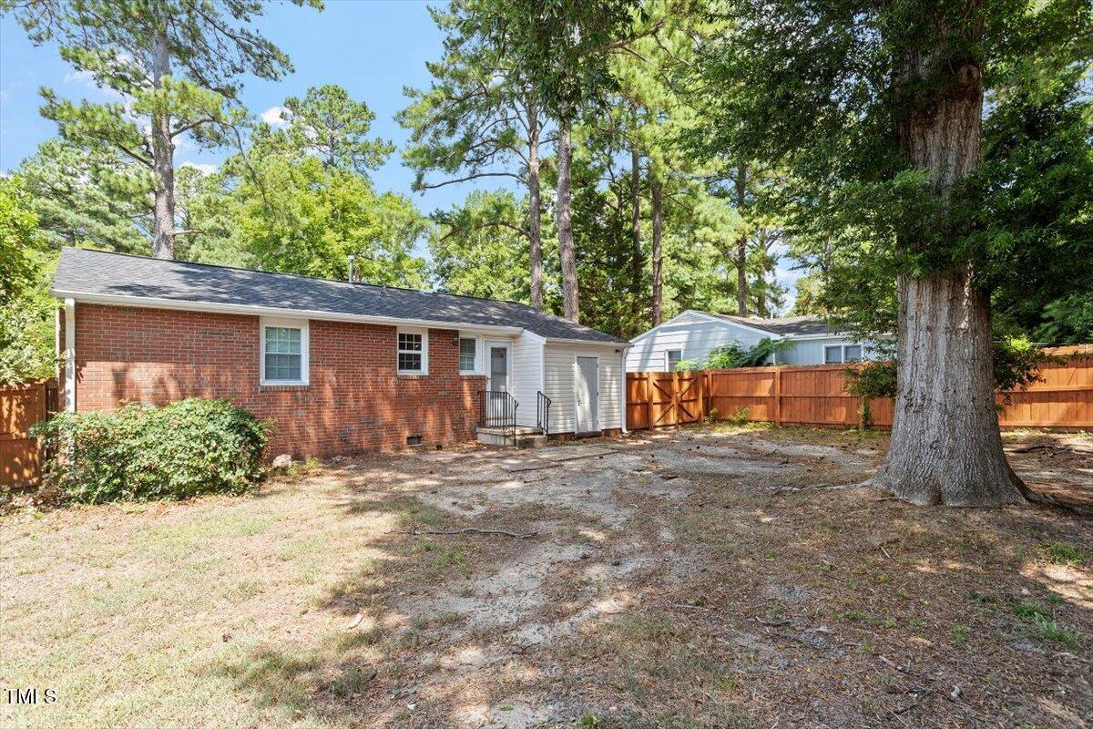 1621 Seminole Trail Raleigh, NC 27609 - Photo 24 of 25 front view of a house with a large trees