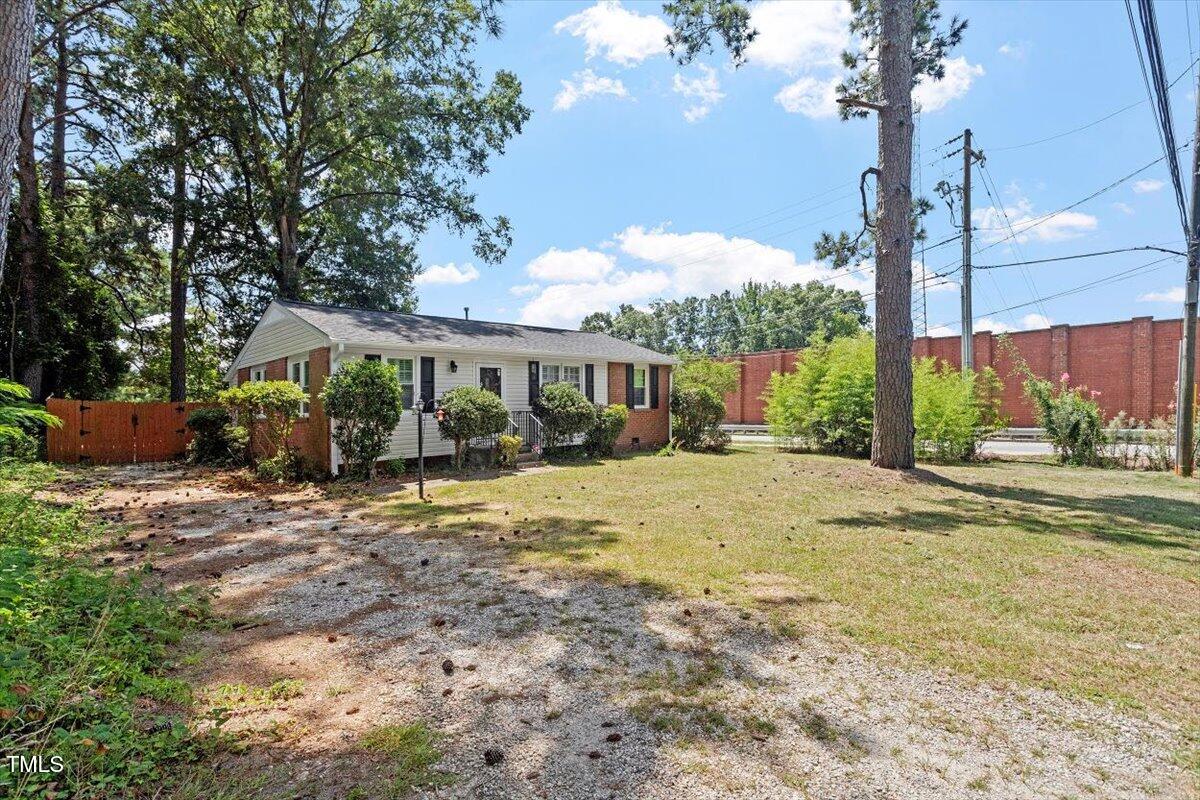 1621 Seminole Trail Raleigh, NC 27609 - Photo 25 of 25 a front view of a house with garden
