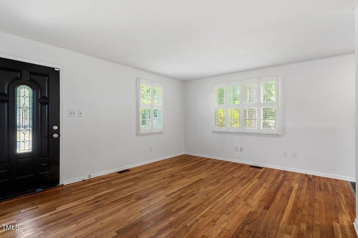 1621 Seminole Trail Raleigh, NC 27609 - Photo 7 of 25 an empty room with windows