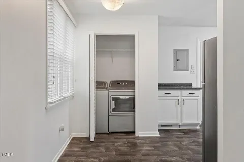a kitchen with stainless steel appliances granite countertop a refrigerator and a stove