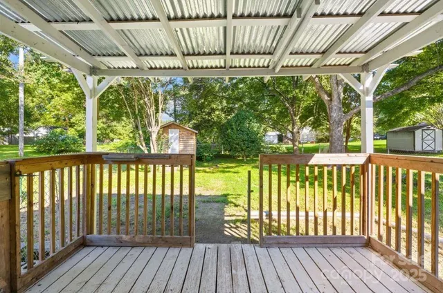 a view of a porch with wooden floor