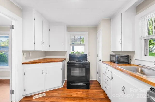 a kitchen with stainless steel appliances granite countertop a stove and a sink