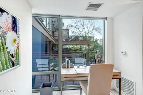 a living room with large windows