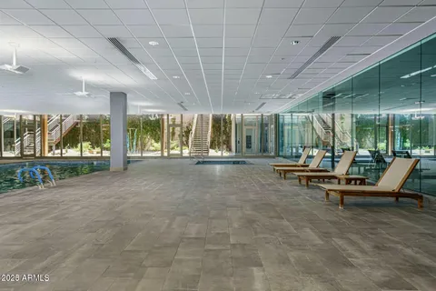 a view of an empty room and wooden floor