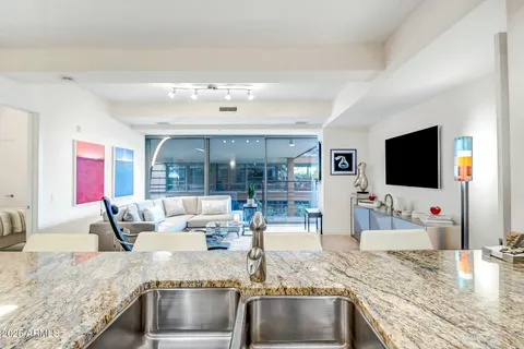 a living room with fireplace furniture and a flat screen tv