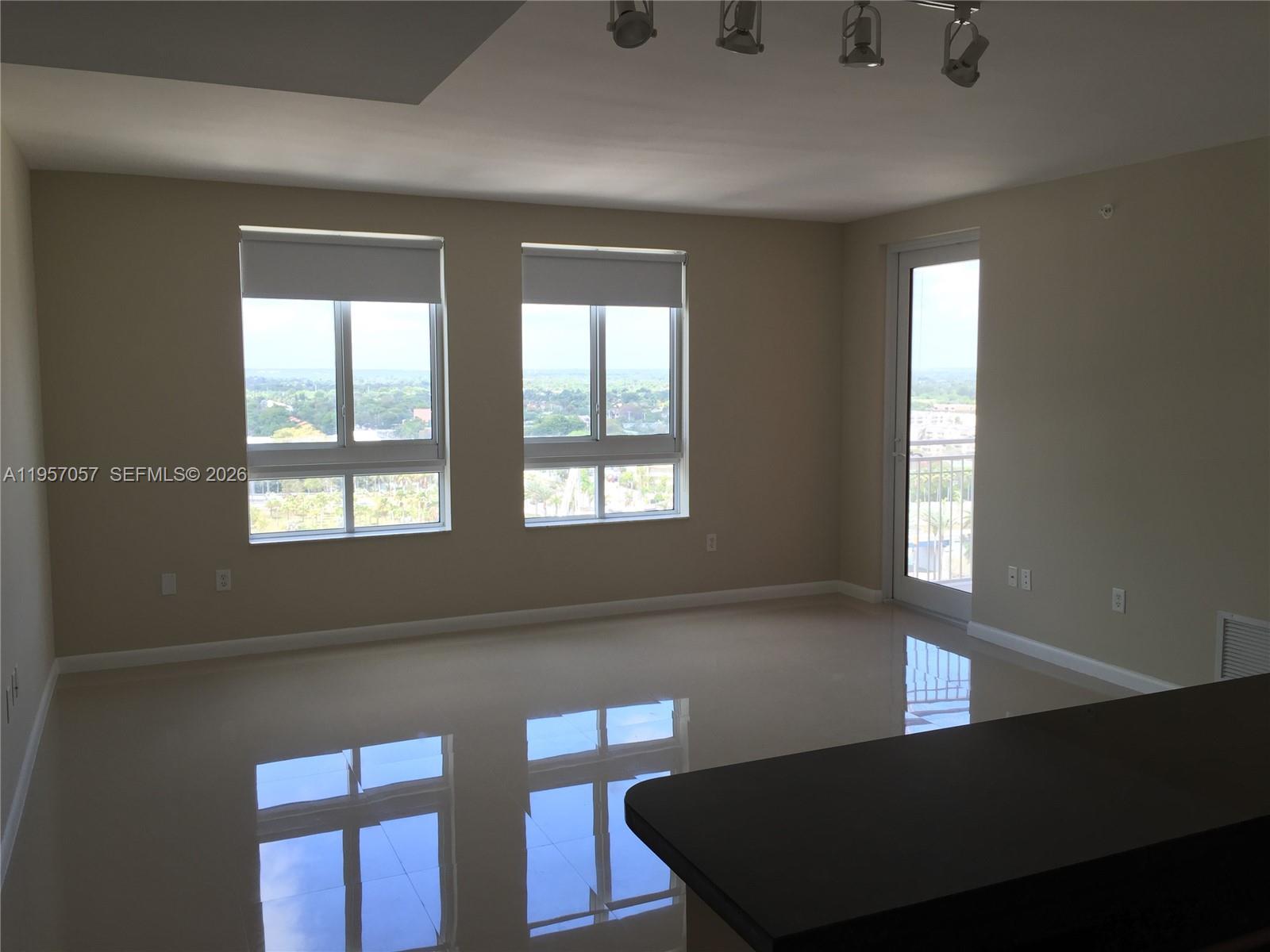 7350 Southwest 89th Street, Unit 1611S Miami, FL 33156 - Photo 3 of 16 a view of an empty room and window