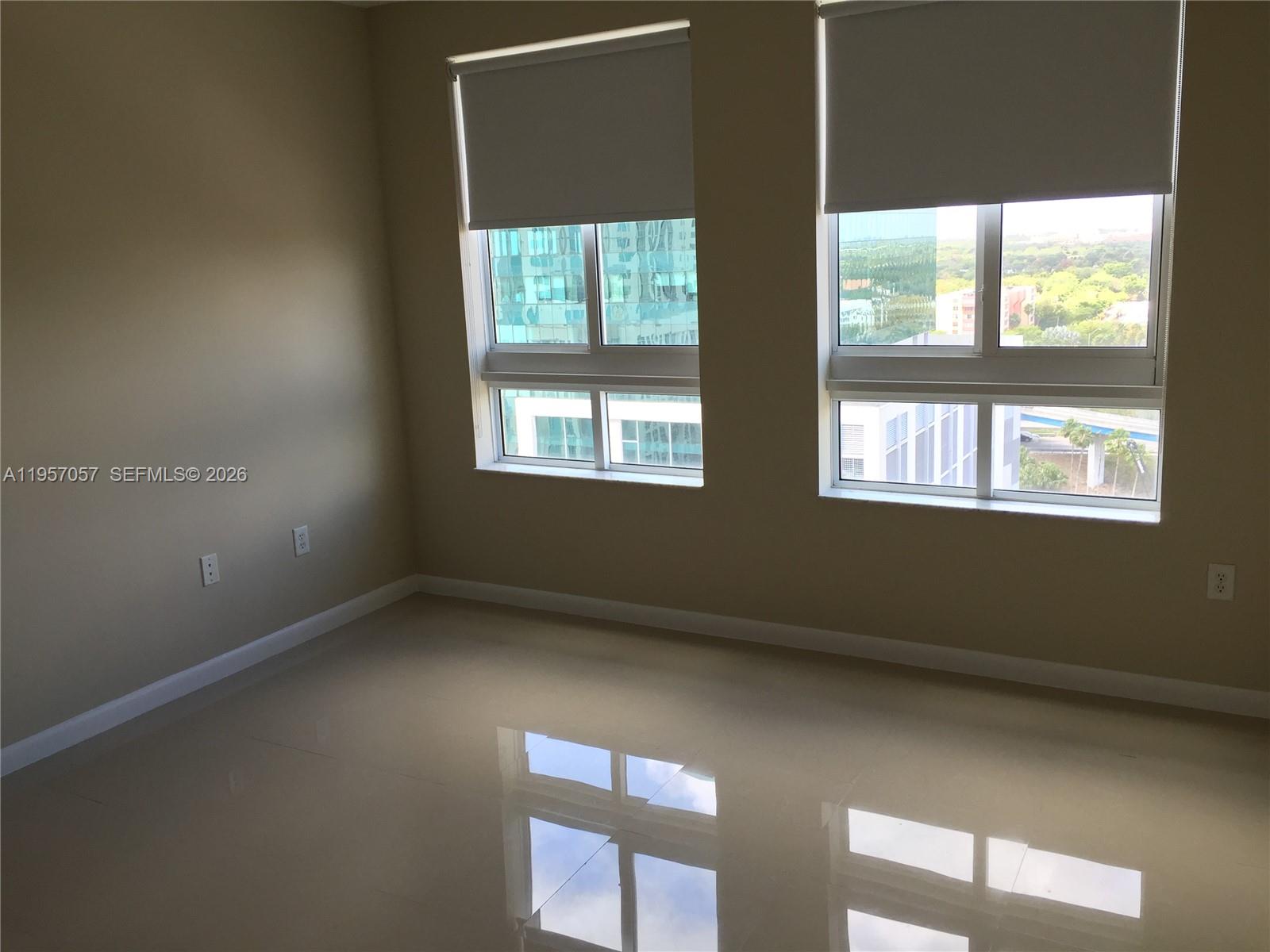 7350 Southwest 89th Street, Unit 1611S Miami, FL 33156 - Photo 8 of 16 a view of an empty room with a window