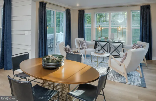 a view of a dining room with furniture and window