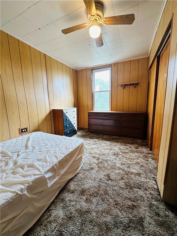 1421 Ridge Avenue Braddock, PA 15104 - Photo 6 of 8 a bedroom with a bed and a dresser