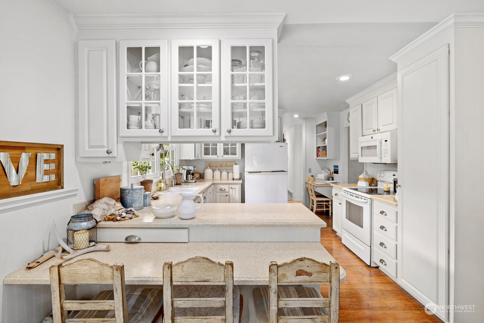 525 192nd Place Southeast Bothell, WA 98012 - Photo 11 of 40 a large kitchen with kitchen island a large window in it and stainless steel appliances