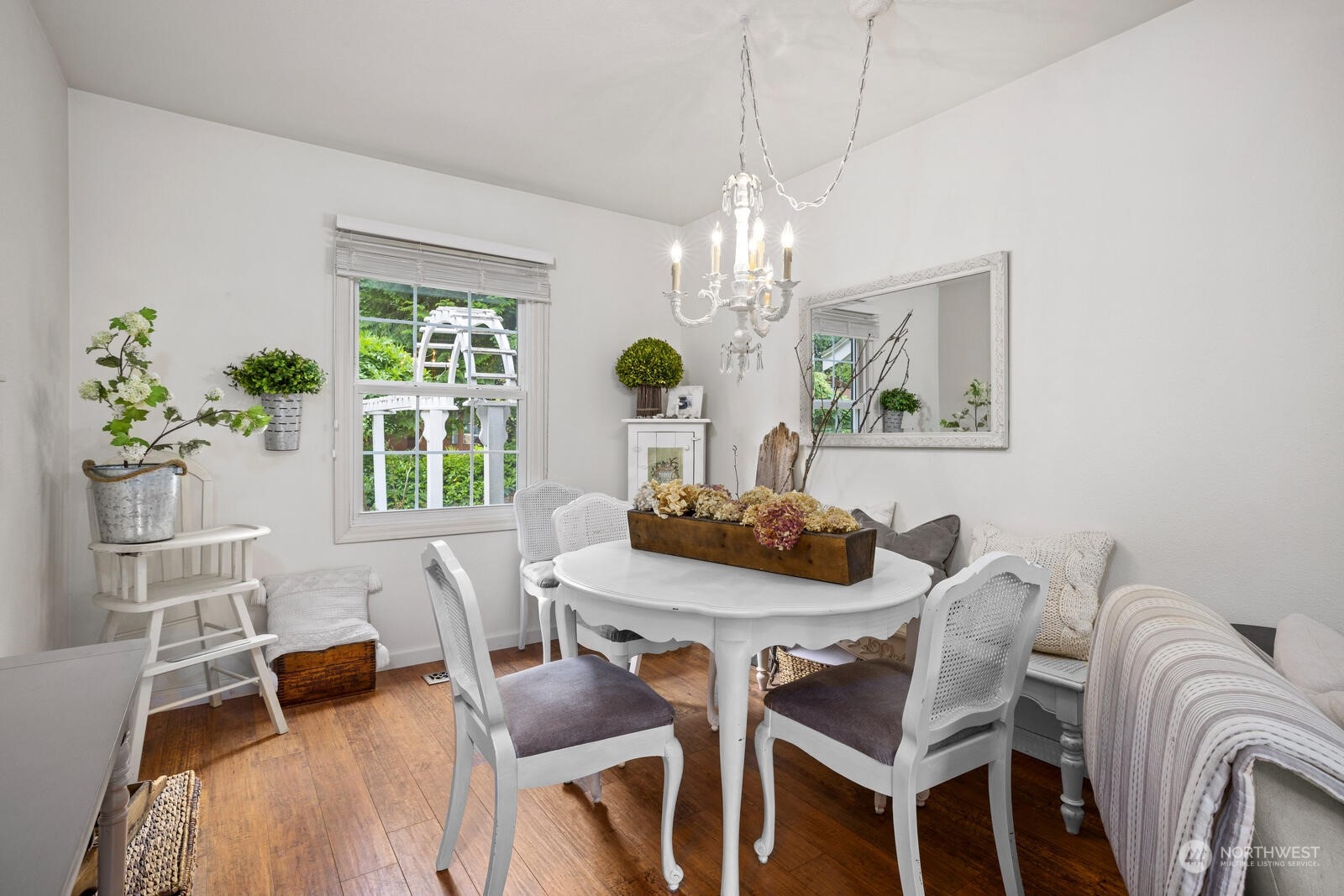 525 192nd Place Southeast Bothell, WA 98012 - Photo 14 of 40 a view of a dining room with furniture a chandelier and wooden floor