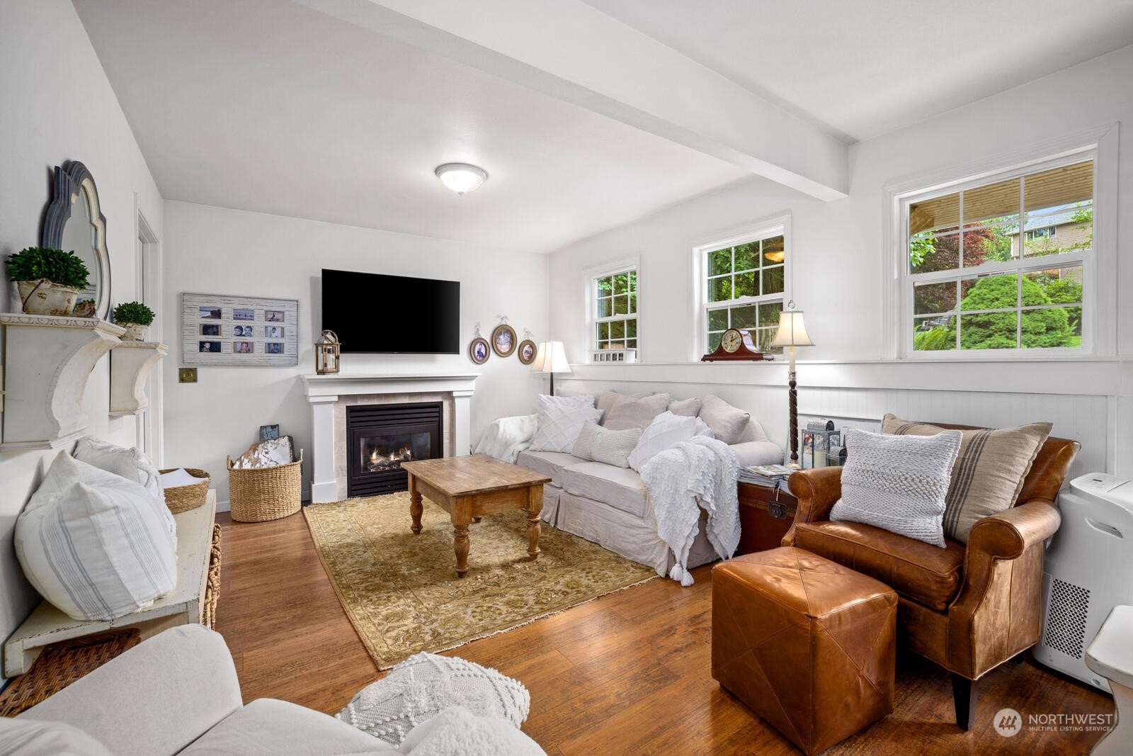 525 192nd Place Southeast Bothell, WA 98012 - Photo 15 of 40 a living room with furniture a fireplace and a flat screen tv