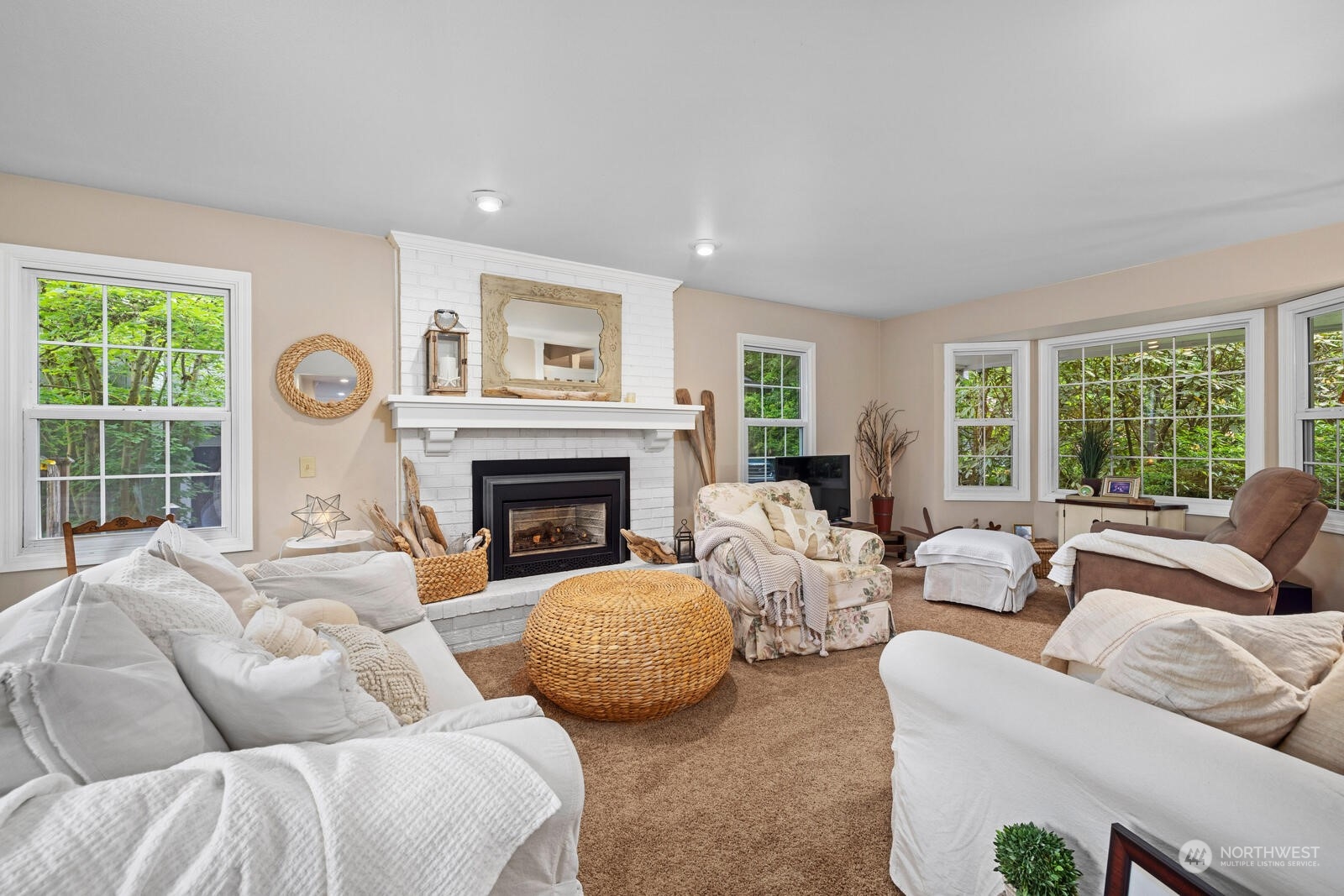 525 192nd Place Southeast Bothell, WA 98012 - Photo 4 of 40 a living room with furniture and a fireplace