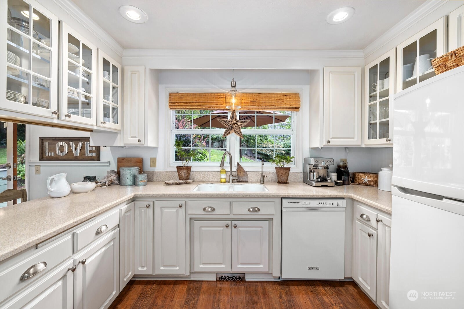 525 192nd Place Southeast Bothell, WA 98012 - Photo 9 of 40 a kitchen with granite countertop a sink and cabinets