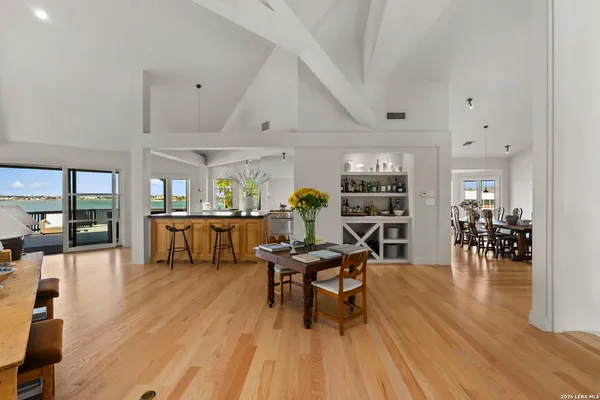 a view of a kitchen with a table and chairs