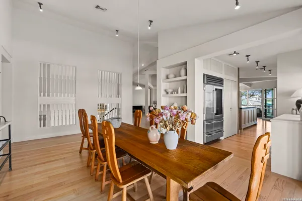 a view of a dining room with furniture and wooden floor
