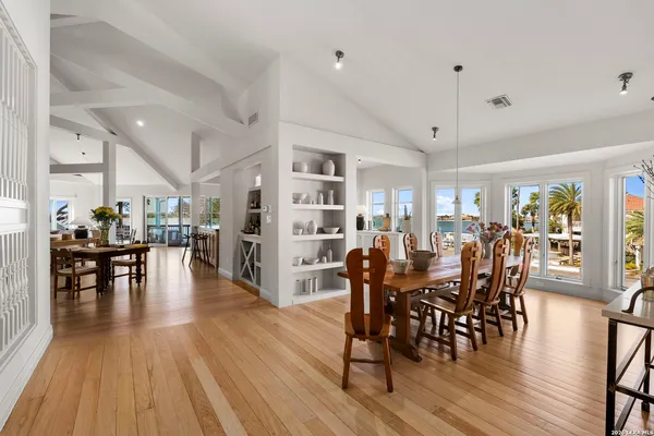 a living room with fireplace furniture and a wooden floor