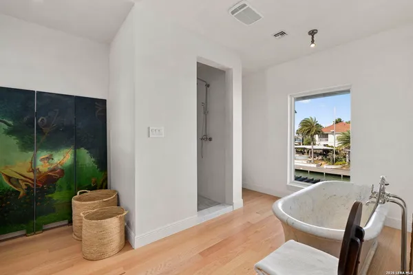 a bathroom with a bathtub and a sink