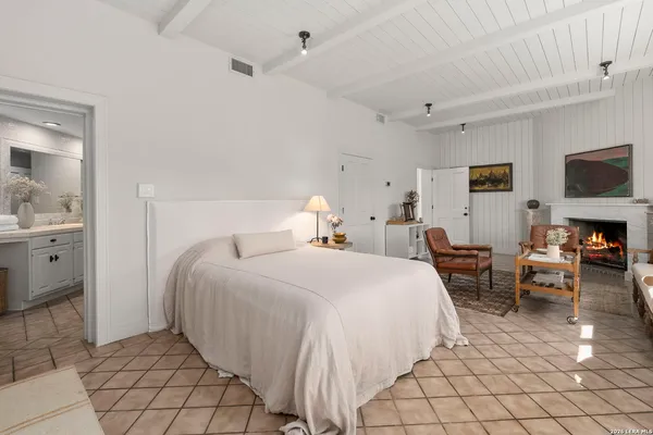 a bathroom with a sink vanity granite and a mirror