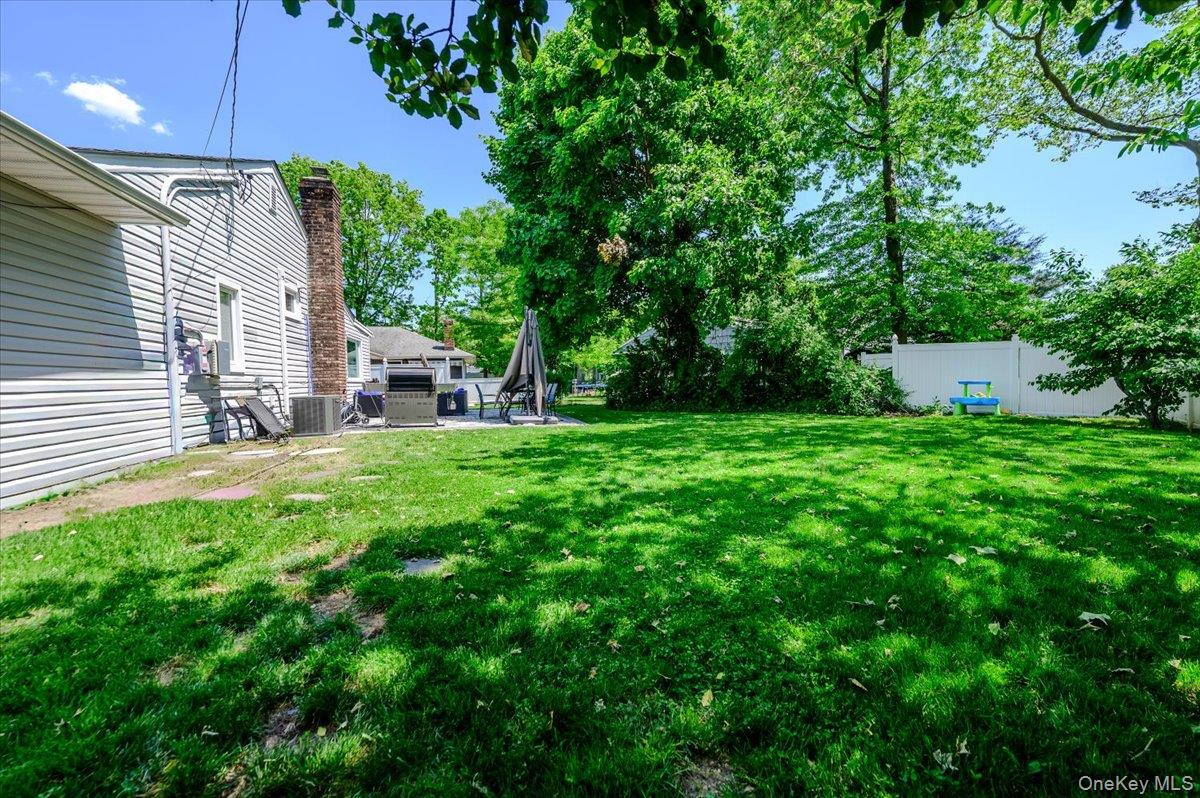 534 Allen Road Woodmere, NY 11598 - Photo 27 of 35 a view of a house with a yard