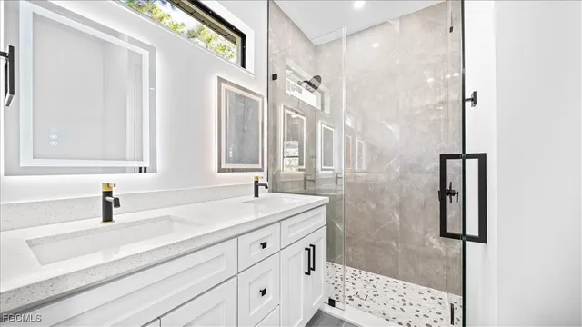 a bathroom with a sink and a mirror