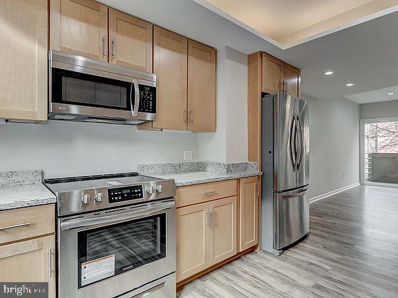 136 Welcome Alley, Unit TH2 Baltimore, MD 21201 - Photo 14 of 39 Modern kitchen with sleek finishes.